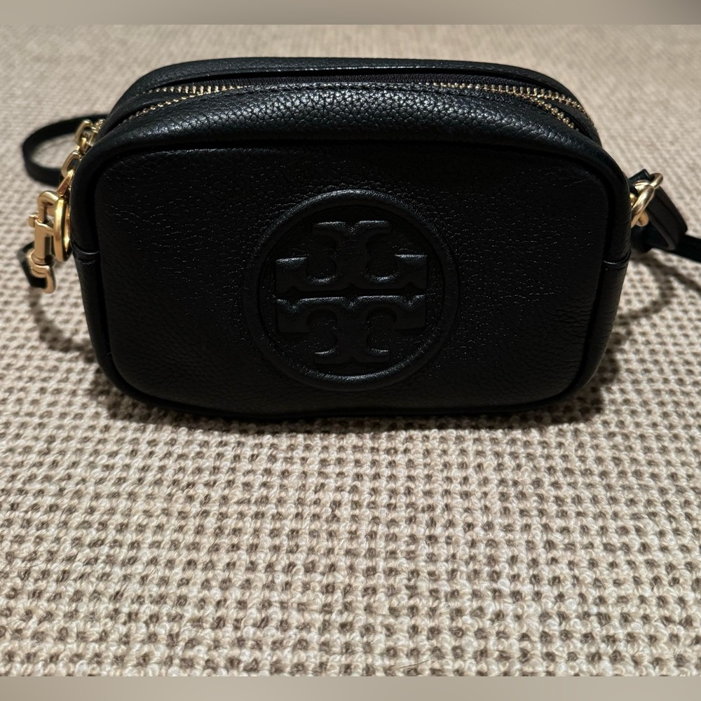 Black and gold Tory Burch camera bag